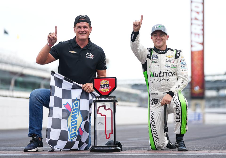 NASCAR Xfinity Series driver AJ Allmendinger (16) and Matt Kaulig, owner of Kaulig Racing, pose for a photo after winning the Pennzoil 150 at the Brickyard on Saturday, July 30, 2022 at Indianapolis Motor Speedway in Indianapolis. 