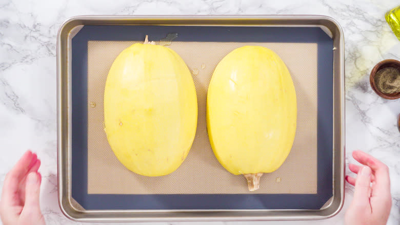 Cut spaghetti squash on sheet