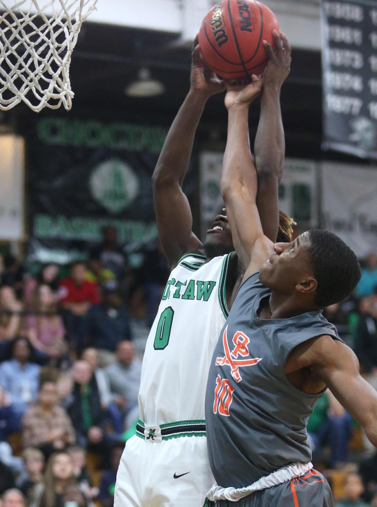 Orange Park's Josiah Sabino (right) blocks a shot against Choctawhatchee during the playoffs. The Raiders are unbeaten to start 2021-22.