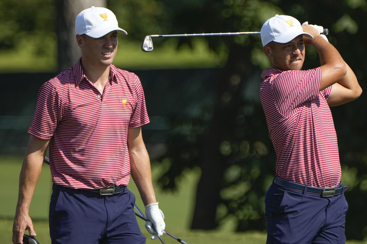 Xander Schauffele, right follows his ball as Justin Thomas looks on from the 13th tee during practice for the Presidents Cup golf tournament at the Quail Hollow Club, Tuesday, Sept. 20, 2022, in Charlotte, N.C. (AP Photo/Chris Carlson)