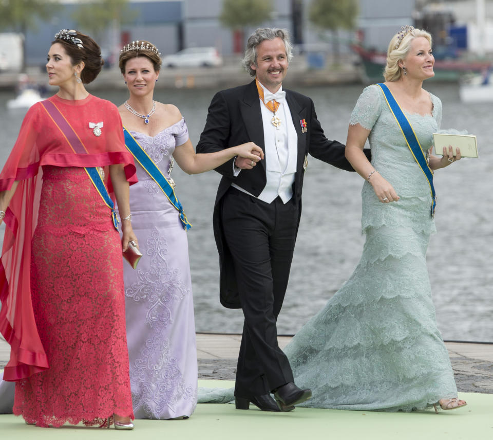 A photo of Crown Princess Mary of Denmark with Crown Princess Mette-Marit of Norway, Ari Behn and Princess Martha Louise walking to Drottningholm Palace after the wedding of Princess Madeleine of Sweden and Christopher O'Neill hosted by King Carl Gustaf and Queen Silvia at The Royal Palace on June 8, 2013 in Stockholm, Sweden.
