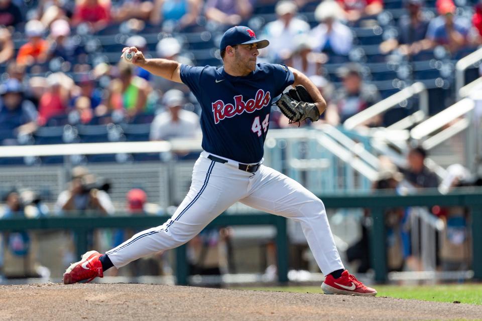 Mississippi pitcher Dylan DeLucia (44) throws a pitch against Arkansas in the first inning during an NCAA College World Series baseball game Thursday, June 23, 2022, in Omaha, Neb. (AP Photo/John Peterson)