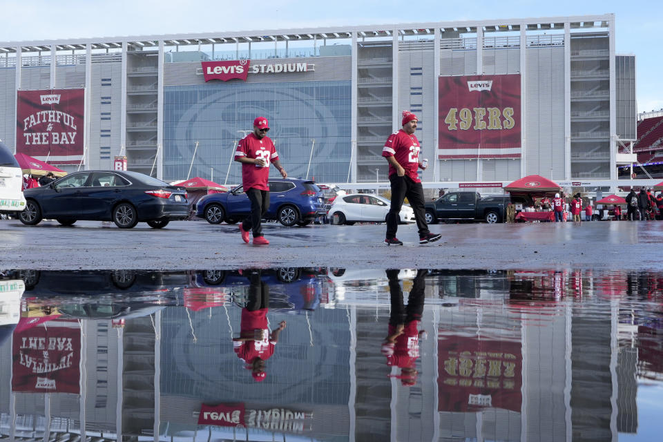 FILE - Fans walk outside Levi's Stadium before an NFL football game between the San Francisco 49ers and the Tampa Bay Buccaneers in Santa Clara, Calif., on Dec. 11, 2022. The former chief lobbyist for the 49ers has testified that a Silicon Valley city councilman illegally leaked a confidential report criticizing the team's political influence, according to the San Francisco Chronicle, Friday, May 19, 2023. (AP Photo/Tony Avelar, File)