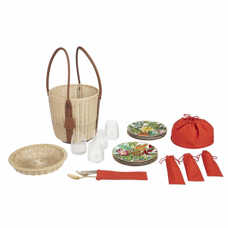 <p>The height of al fresco luxury, this is a picnic set for the host that has it all. The hand-woven wicker basket, with details of smooth bull calf leather, contains everything you need for a party of four –crystal glasses, cutlery and ‘Passifolia’ china plates. £12,350, <a href="https://www.hermes.com/uk/en/" rel="nofollow noopener" target="_blank" data-ylk="slk:hermes.com;elm:context_link;itc:0;sec:content-canvas" class="link ">hermes.com</a></p>