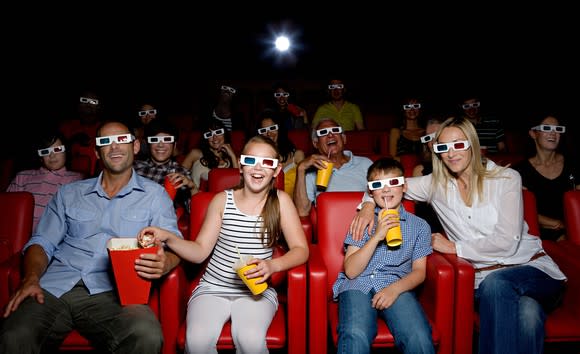 Moviegoers watching a 3D film wearing 3D glasses.