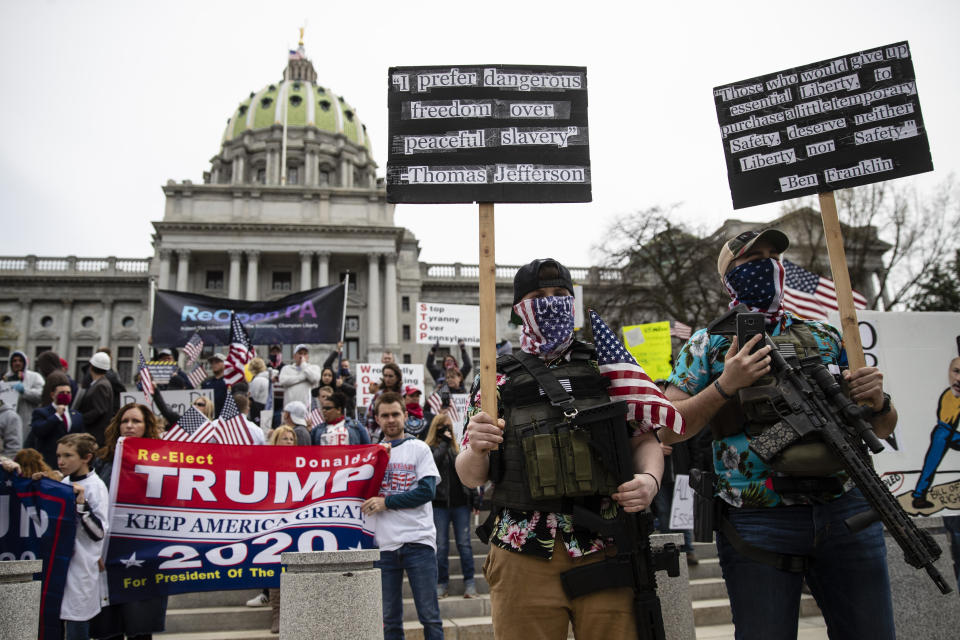 FILE - In this April 20, 2020, file photo protesters demonstrate at the state Capitol in Harrisburg, Pa., demanding that Gov. Tom Wolf reopen Pennsylvania's economy even as new social-distancing mandates took effect at stores and other commercial buildings. (AP Photo/Matt Rourke, File)