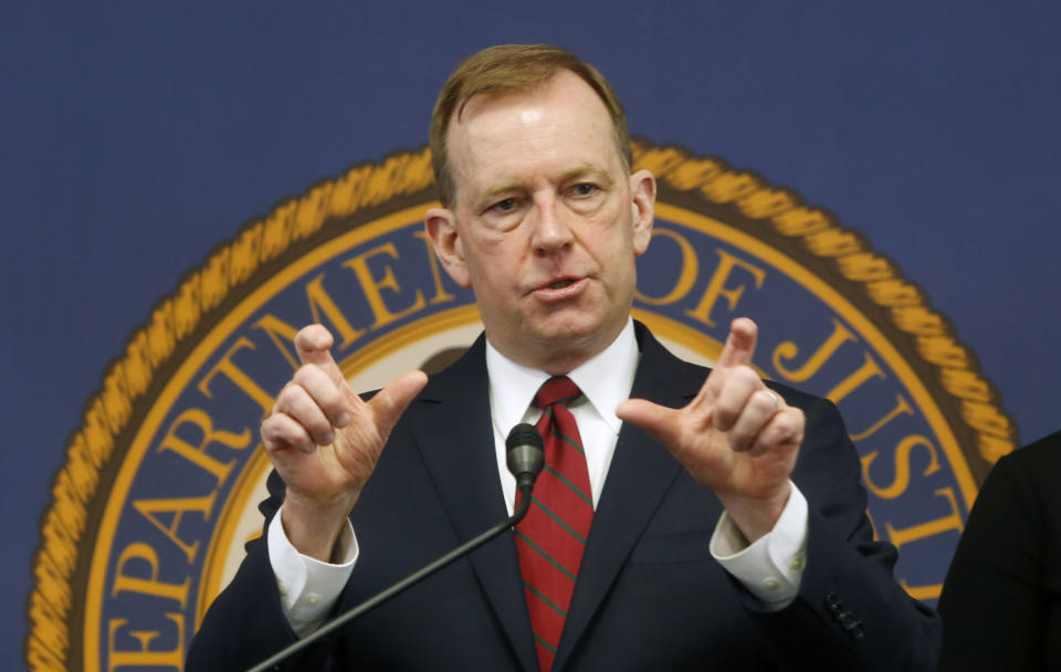 McGregor Scott, the U.S. Attorney for the Eastern District of California, answers questions concerning the plea deal reached with the owners of a San Francisco Bay Area solar energy company that have pleaded guilty for participating in what federal prosecutors called a massive Ponzi scheme that defrauded investors of $1 billion, during a news conference in Sacramento Calif., Friday, Jan. 24, 2020. Jeff and Paulette Carpoff entered guilty pleas involving the scam that could result in up to 30 years in prison for him, and up to 15 years in prison for her. (AP Photo/Rich Pedroncelli)