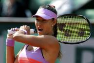 Vitalia Diatchenko of Russia plays a shot to compatriot Maria Sharapova during their women's singles match at the French Open tennis tournament at the Roland Garros stadium in Paris, France, May 27, 2015. REUTERS/Gonzalo Fuentes