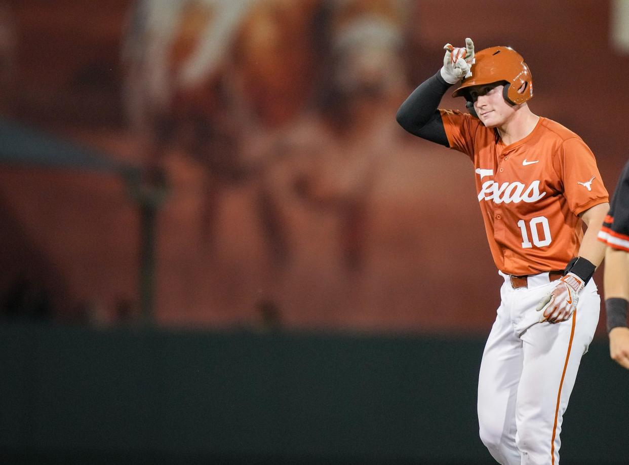 Texas catcher Kimble Schuessler (10) throws up horns as the Longhorns play Sam Houston at UFCU Disch–Falk Field on Tuesday, April 30, 2024.