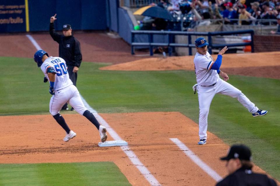 René Pinto, 50, rounds the bases after hitting a home run during the Durham Bulls season opener against the Norfolk Tides, Friday March 31, 2023 at the Durham Bulls Athletic Park.