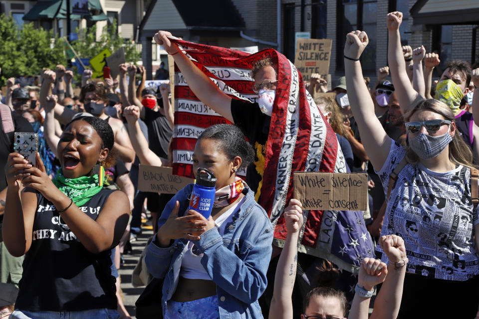 People participate in a Black Lives Matter rally on Mount Washington in Pittsburgh on Sunday, June 7, 2020, during a protest over the death of George Floyd, who died May 25 after being restrained by police in Minneapolis. (AP Photo/Gene J. Puskar)