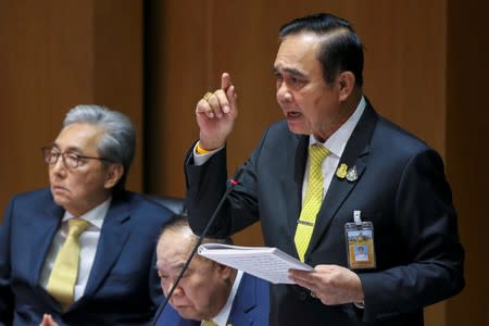 Thailand's Prime Minister Prayuth Chan-ocha delivers the policy statement of the council of ministers to the parliament at the parliament in Bangkok