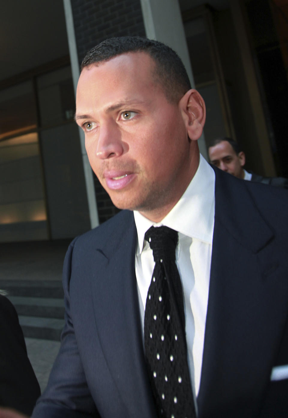 FILE- In this Sept. 30, 2013 file photo, Alex Rodriguez leaves the offices of Major League Baseball in New York. Rodriguez has accepted his season-long suspension from Major League Baseball, the longest penalty in the sport's history related to performance-enhancing drugs. Rodriguez withdrew his lawsuits against Major League Baseball, Commissioner Bud Selig and the players' association to overturn his season-long suspension on Friday, Feb. 7, 2014. The notices of dismissal were filed in federal court in Manhattan. (AP Photo/David Karp, File)