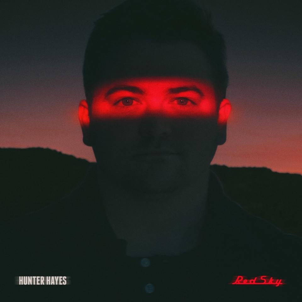 Album cover for Red Sky by Hunter Hayes, showing Hunter's eyes illuminated in red