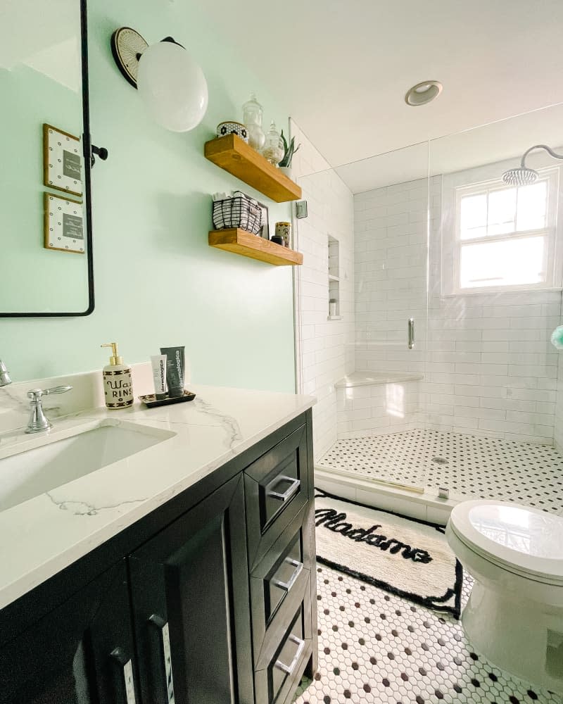 Black and white penny tile in renovated bathroom.