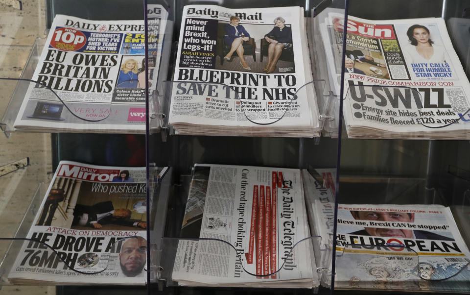 Newspapers are seen displayed for sale in London, Tuesday, March 28, 2017. Britain's Daily Mail newspaper has sparked complaints with a front page photograph focusing on the legs of Prime Minister Theresa May and Scottish First Minister Nicola Sturgeon. The photo of the two leaders published Tuesday displays their legs prominently alongside a headline speculating about which leader won the "Legs-it" competition — a play on Brexit. (AP Photo/Kirsty Wigglesworth)