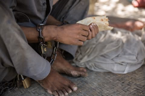 Faizal Faizal says he doesn't know why his family brought him to the shrine - Credit: Stefanie Glinski