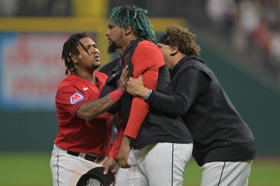 Aug 5, 2023; Cleveland, Ohio, USA; Cleveland Guardians third baseman Jose Ramirez, left, and first baseman <a class="link " href="https://sports.yahoo.com/mlb/players/10572" data-i13n="sec:content-canvas;subsec:anchor_text;elm:context_link" data-ylk="slk:Josh Naylor;sec:content-canvas;subsec:anchor_text;elm:context_link;itc:0">Josh Naylor</a>, right, hold back relief pitcher Emmanuel Clase (48) after a fight during the sixth inning against the Chicago White Sox at Progressive Field. Mandatory Credit: Ken Blaze-USA TODAY Sports