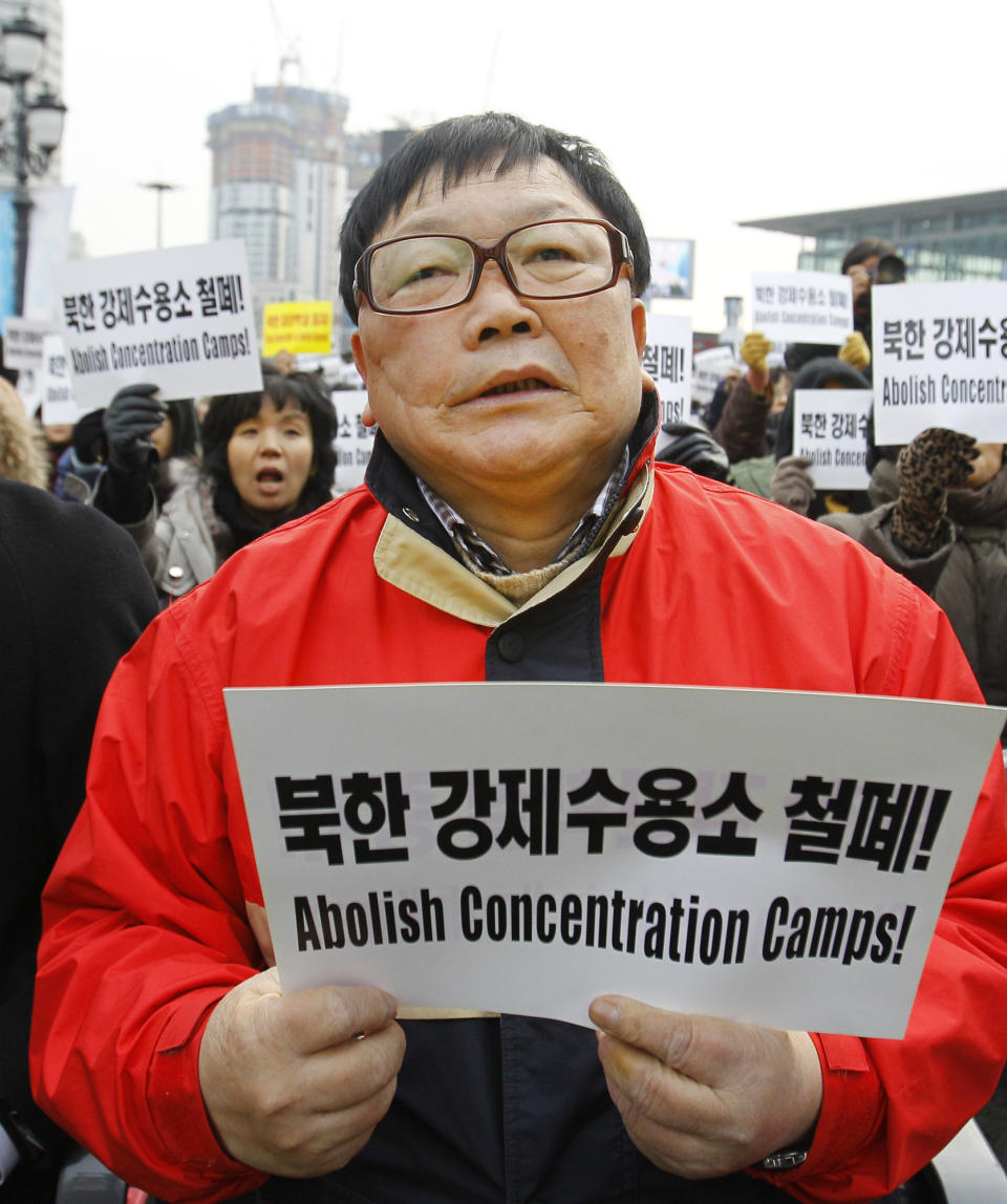 In this photo taken on Dec. 9, 2011, Oh Kil-nam, a South Korean, who defected with his family to the communist North after being lured by promises of an important job and free medical treatment for his ill wife, and then later fled the country leaving his family behind, shouts slogans during a rally denouncing North Korea's alleged genocide and crimes against humanity in Seoul, South Korea. (AP Photo/Lee Jin-man)