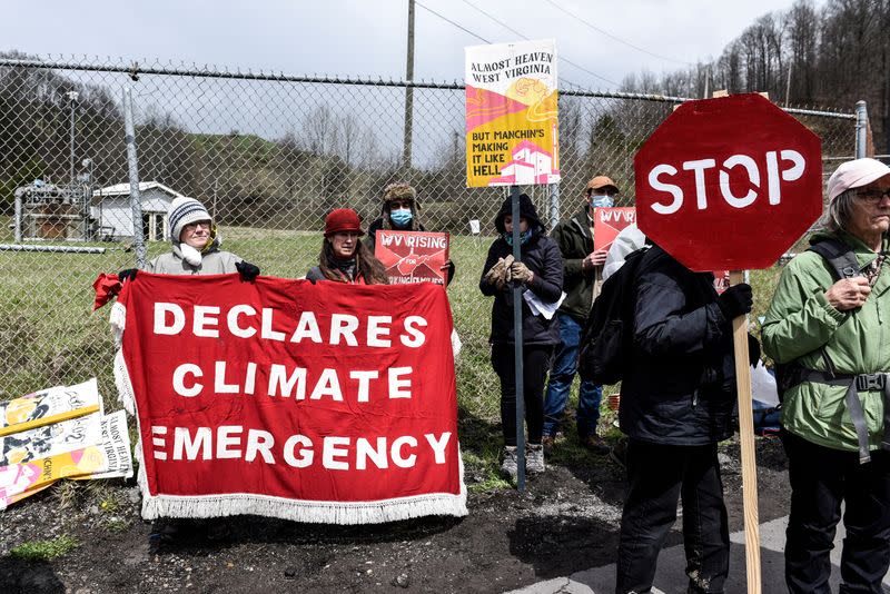 FILE PHOTO: People protest against Senator Manchin in West Virginia