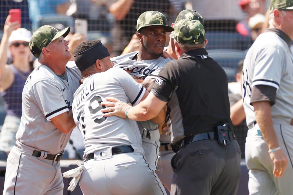 Jose Abreu #79 holds back Tim Anderson #7 of the Chicago White Sox after a benches-clearing dispute between Yasmani Grandal #24 of the Chicago White Sox (not pictured) and Josh Donaldson #28 of the New York Yankees (not pictured) during the fifth inning at Yankee Stadium on May 21, 2022 in the Bronx borough of New York City.