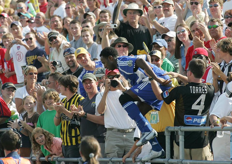 (NCL MLSSTAR LAURON MERZ 30JUL05) Major League Soccer All Star and former Crew player Jeff Cunningham jumped into the stands with the fans after scoring his first goal during the second half of the MLS All Star game at the Columbus Crew Stadium, July 29, 2005. Cunningham scored twice in the second half. (Dispatch photo by Neal C. Lauron)