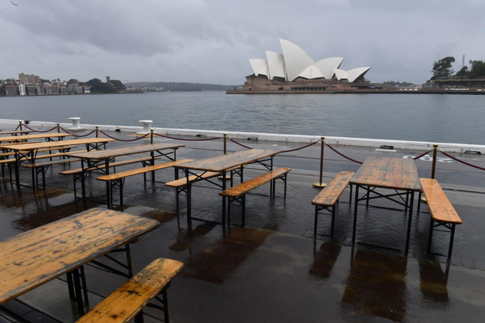 An empty seating area overlooking the Sydney Opera House during coronavirus lockdown.