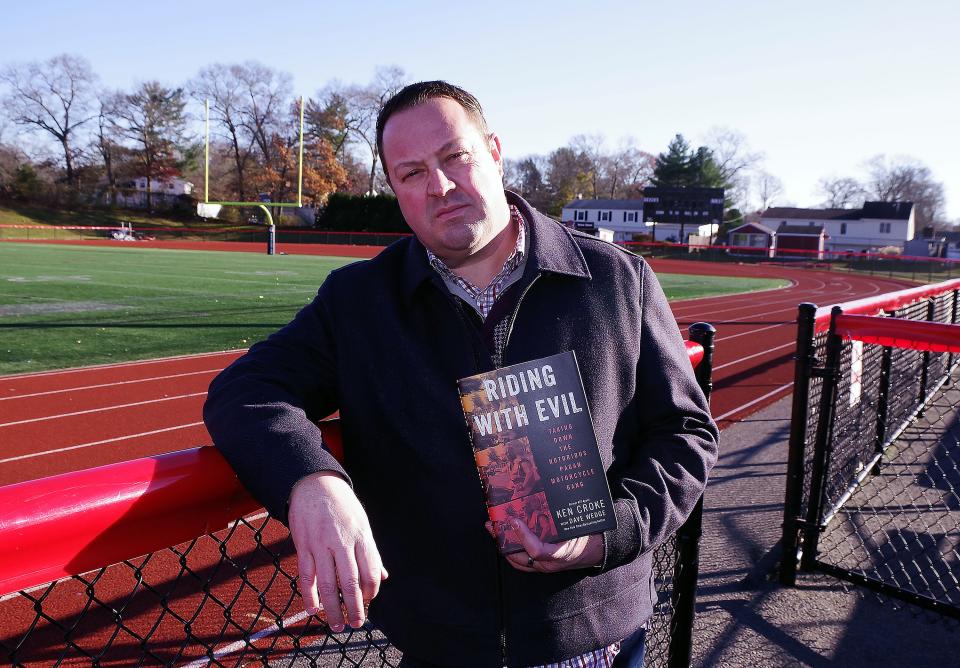 Writer Dave Wedge, a Brockton native and 1988 graduate of Brockton High School, with his latest book, "Riding With Evil" on Tuesday, Nov. 22, 2022.