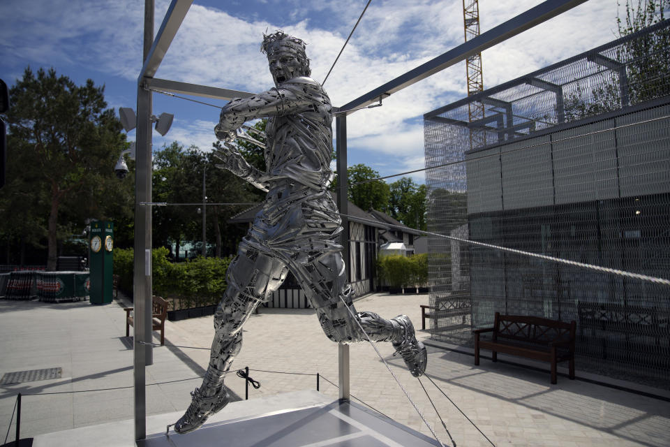 A statue of Spanish artist Jordi Diez representing Spain's Rafael Nadal is seen at the Roland Garros stadium, in Paris, Friday, May 28, 2021. (AP Photo/Christophe Ena)