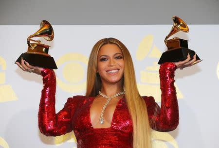 Beyonce holds the awards she won for Best Urban Contemporary Album for "Lemonade" and Best Music Video for "Formation" at the 59th Annual Grammy Awards in Los Angeles, California, U.S. , February 12, 2017. REUTERS/Mike Blake