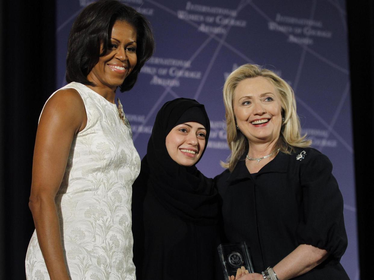 The move is in retaliation for criticism of the arrests of Saudi civil rights activists, including Samar Badawi, pictured above with Michelle Obama and Hillary Clinton: Reuters