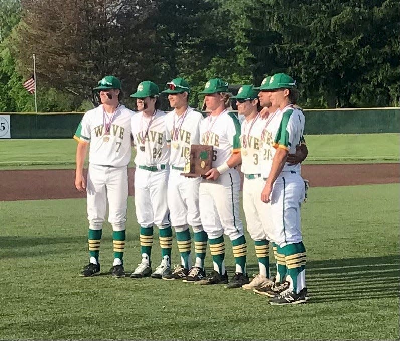 Newark Catholic's captains pose with the Division IV district championship trophy after knocking off Cardington 4-2 Wednesday night at Mount Vernon Nazarene University.