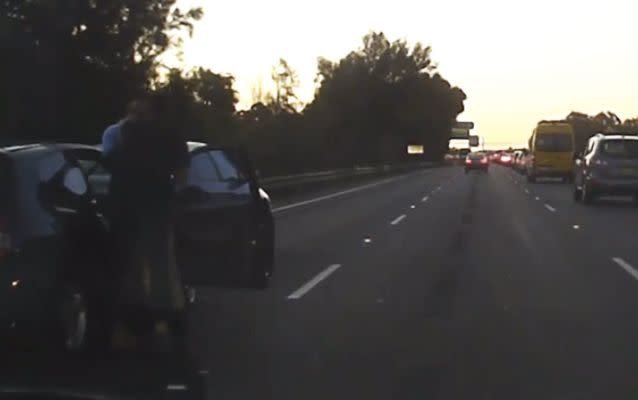 The furious motorist pinned the hatchback driver against his vehicle and shouted at him. Source: Dash Cam Owners Australia.