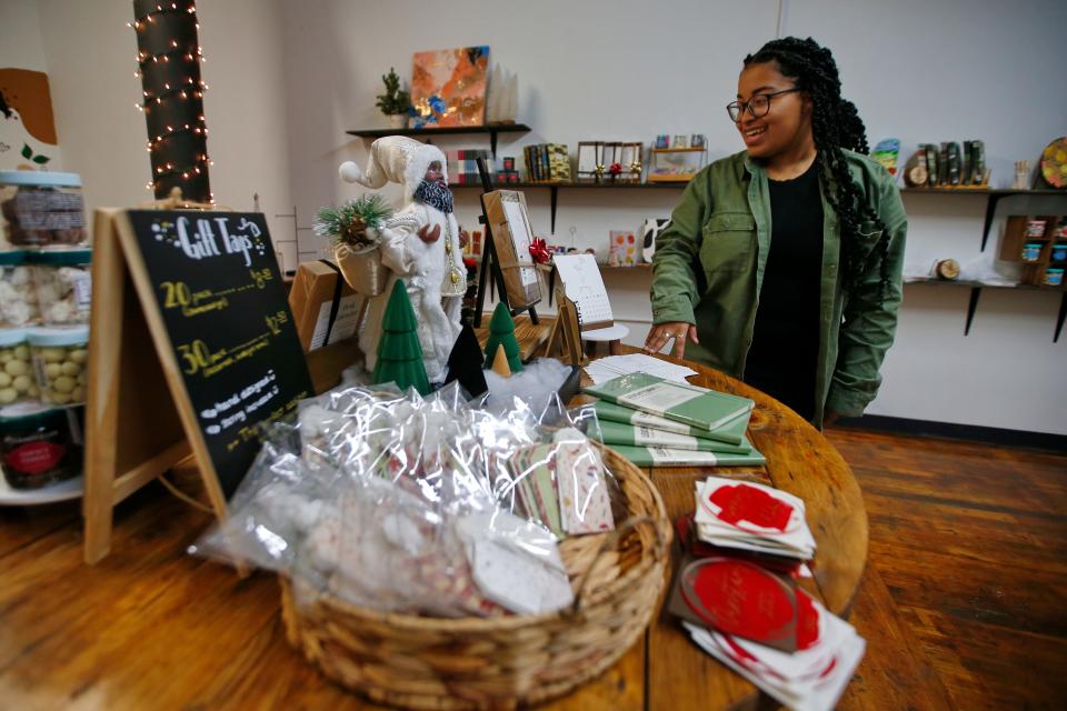 Jaden Reyes, owner, talks about her eclectic collection of paper goods on sale at the newly opened Brown Suga Stationery & Print Shop in the Kilburn Mill in New Bedford.