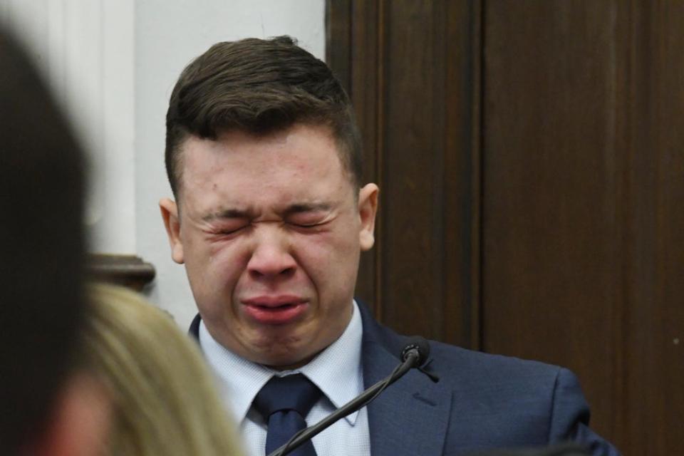 Kyle Rittenhouse becomes emotional as he testifies during his trial at the Kenosha County Courthouse on 10 Novemberl. He was later acquitted by a jury. (Getty Images)