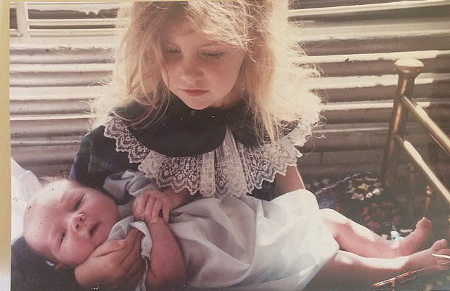 Lena Dunham seems slightly perplexed by her younger sister in this throwback snap.