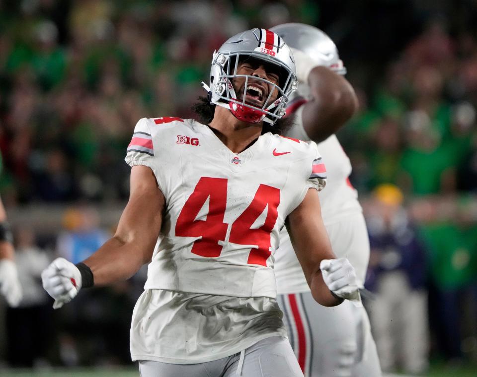 Sep 23, 2023; South Bend, Indiana, USA; Ohio State Buckeyes defensive end JT Tuimoloau (44) celebrates after knocking down a pass against Notre Dame Fighting Irish during the fourth quarter of their game at Notre Dame Stadium.