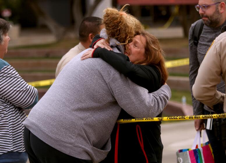 LAS VEGAS, NV - DECEMBER 7, 2023 - A UNLV student is hugged by a campus worker, right, at the scene where three people died and one person was injured in a mass shooting at the UNLV campus. Photo taken on December 7, 2023. (Genaro Molina / Los Angeles Times)