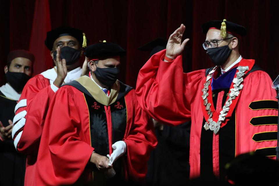 Chair of the Rutgers Board of Trustees, Tilak Lal puts a medal on Jonathan Scott Holloway. Holloway is introduced at his inauguration ceremony as Rutgers celebrates it's first African American president as the 21st President of Rutgers at the Rutgers Athletic Center in Piscataway, NJ on November 5, 2021.