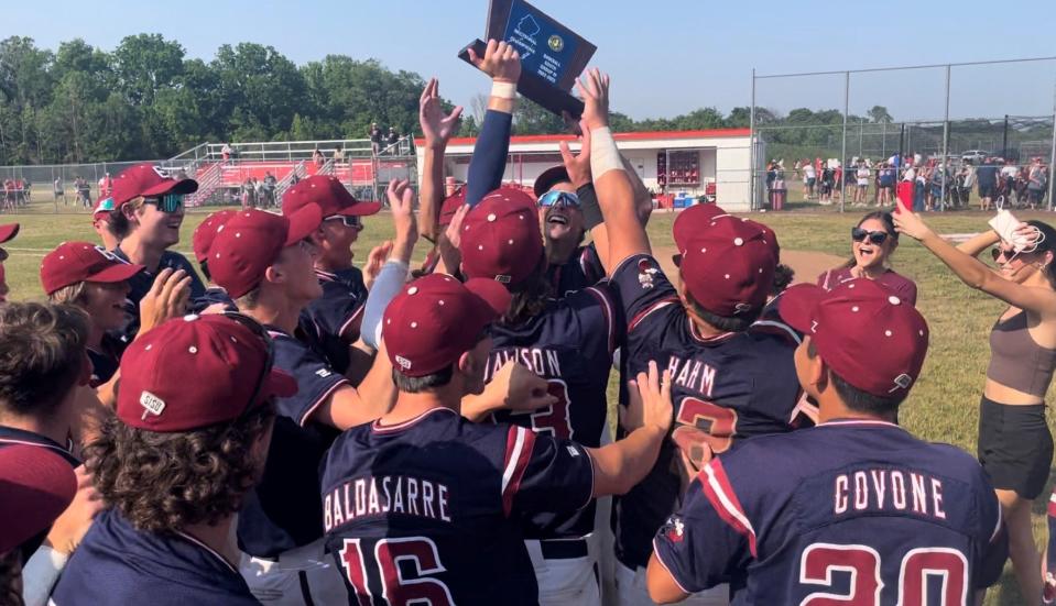 The Eastern Regional High School baseball team reacts celebrates with the trophy after defeating Rancocas Valley 2-0 in the South Jersey Group 4 final on Friday, June 2, 2023.