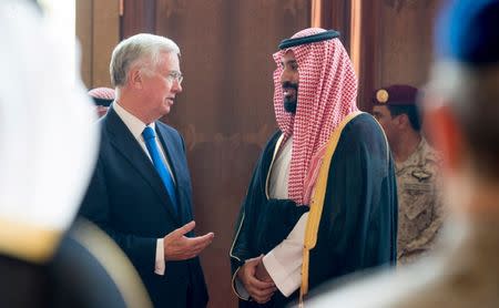 Saudi Crown Prince Mohammed bin Salman speaks with British Defence Secretary Michael Fallon during a meeting in Jeddah, Saudi Arabia September 19, 2017. Saudi Press Agency/Handout via REUTERS