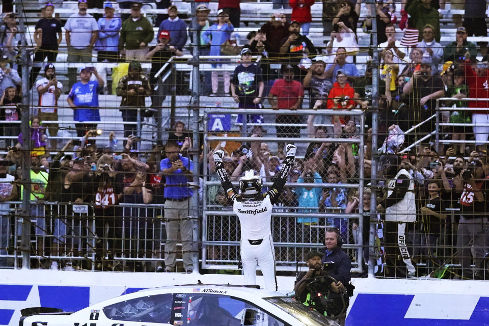 Aric Almirola celebrates after winning the NASCAR Cup Series auto race Sunday, July 18, 2021, in Loudon, N.H. (AP Photo/Charles Krupa)