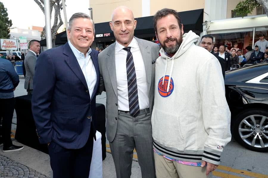 Netflix boss Ted Sarandos, Mark Strong and Adam Sandler at the Westwood premiere of “Murder Mystery 2.” (Courtesy Netflix)