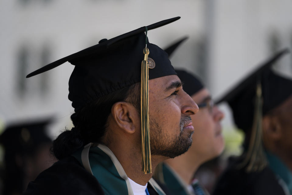 Incarcerated graduate Gerald Massey listens to a speech during his graduation ceremony at Folsom State Prison in Folsom, Calif., Thursday, May 25, 2023. Many more prisoners like Massey will have opportunities to leave prison with bachelor's degrees, when new federal rules on financial aid for higher education take effect in July. (AP Photo/Jae C. Hong)