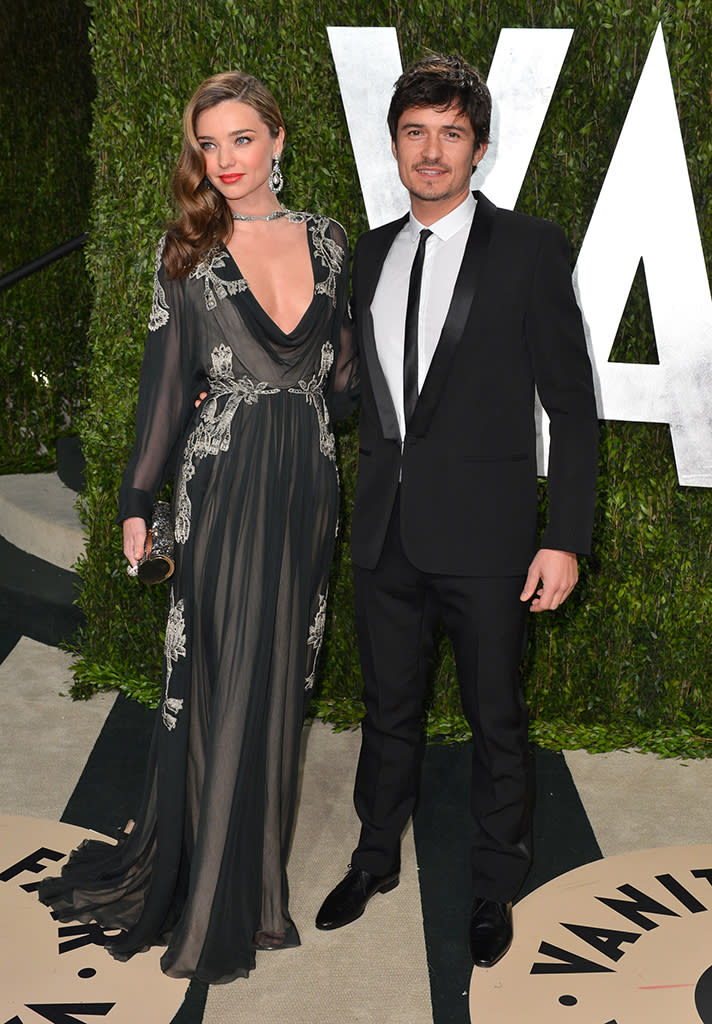 Orlando Bloom (R) and Miranda Kerr arrive at the 2013 Vanity Fair Oscar Party hosted by Graydon Carter at Sunset Tower on February 24, 2013 in West Hollywood, California.