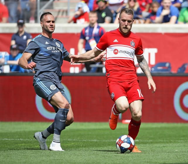 BRIDGEVIEW, ILLINOIS - MAY 25: Aleksandar Katai #10 of Chicago Fire advances agauinst Maxime Chanot #4 of New York City FC at SeatGeek Stadium on May 25, 2019 in Bridgeview, Illinois. The Fire and NYCFC tied 1-1. (Photo by Jonathan Daniel/Getty Images)