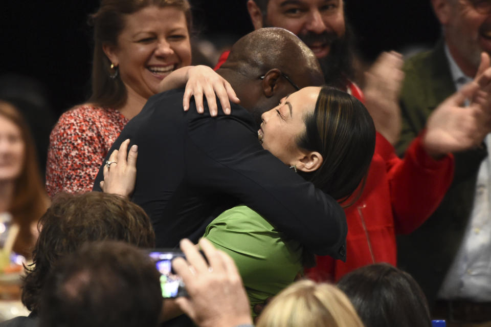 Barry Jenkins, left, embraces Lulu Wang after Zhao Shuzhen wins the award for best supporting female for "The Farewell" at the 35th Film Independent Spirit Awards on Saturday, Feb. 8, 2020, in Santa Monica, Calif. (AP Photo/Chris Pizzello)