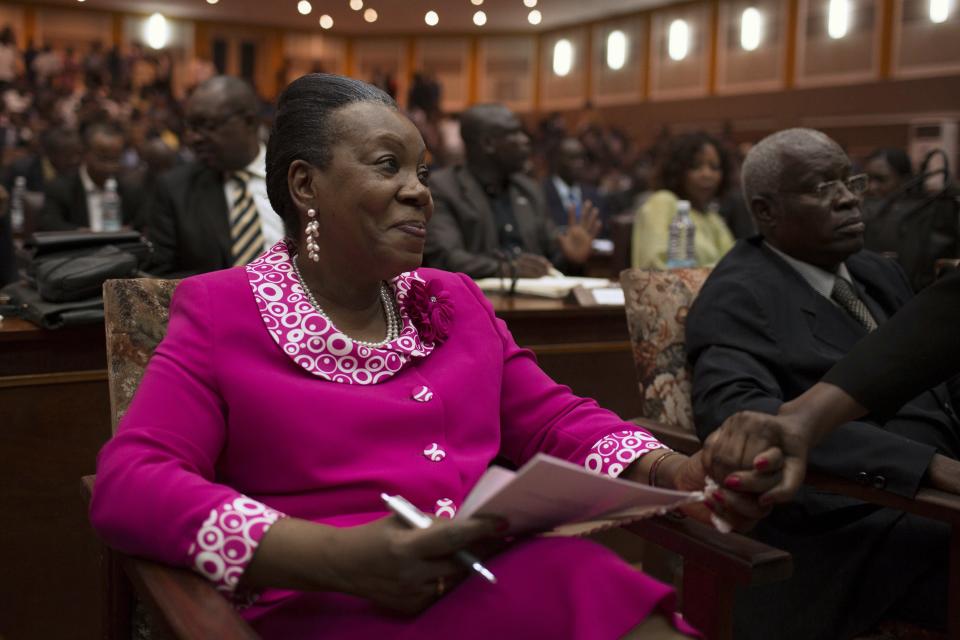 Samba-Panza shakes hands with a supporter after she was elected as Central African Republic's interim president at the national assembly in Bangui