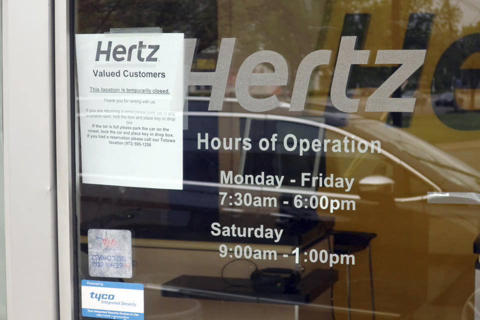 FILE - In this May 6, 2020, file photo, a Hertz car rental is closed during the coronavirus pandemic in Paramus, N.J. Hertz filed for bankruptcy protection Friday, May 22, 2020, unable to withstand the pandemic that has crippled global travel and with it, the heavily indebted 102-year-old car rental company's business. (AP Photo/Ted Shaffrey, File)