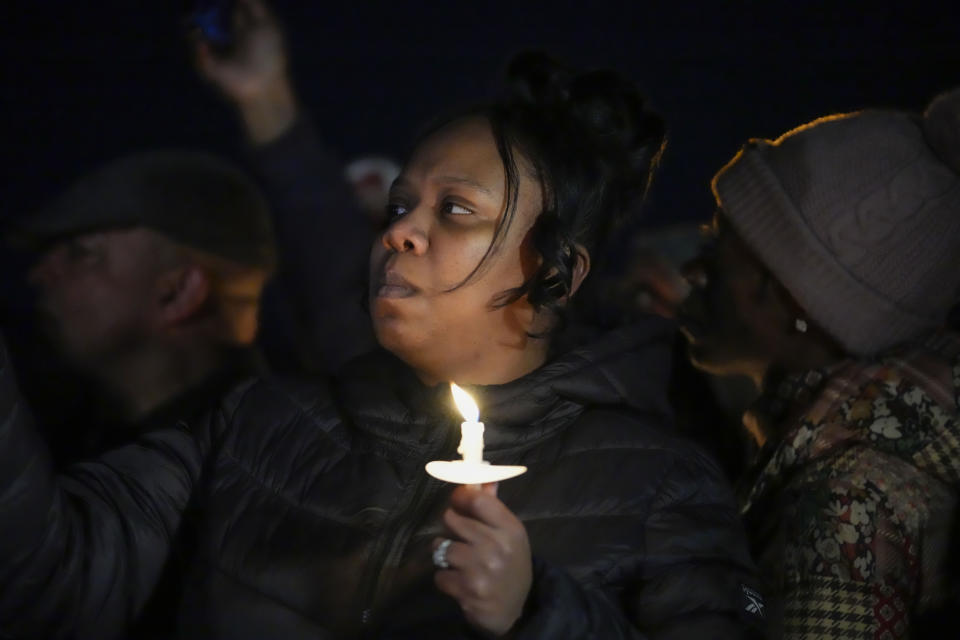 A person holds a candle during a vigil for Tyre Nichols, who died after being beaten by Memphis police officers, in Memphis, Tenn., Thursday, Jan. 26, 2023. (AP Photo/Gerald Herbert)